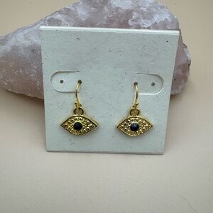 Gold Eye Drop Earrings with Black Stone. 74
